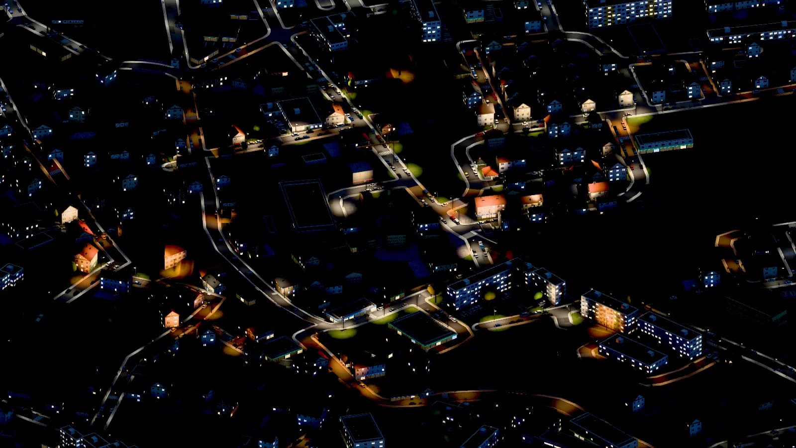 Ta sama mapa gry nocą, z oświetlonymi ulicami i oknami.
